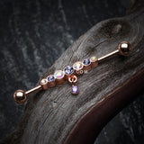 Detail View 1 of Rose Gold Dazzling Gem Row Sparkle Dangle Industrial Barbell-Tanzanite/Aurora Borealis