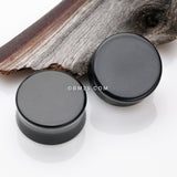 Detail View 1 of A Pair of Solid Black Flat Glass Double Flared Plug-Black