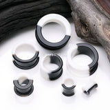 Detail View 2 of A Pair of Black and White Duo Tone Flexible Silicone Double Flared Tunnel Plug