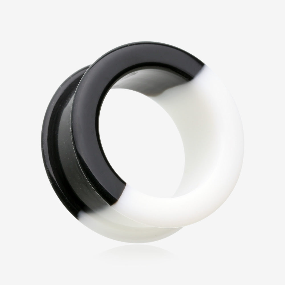 A Pair of Black and White Duo Tone Flexible Silicone Double Flared Tunnel Plug