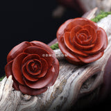 Detail View 1 of A Pair of Smooth End Rosebud Full Bloom Sabo Wood Double Flared Plug-Orange/Brown